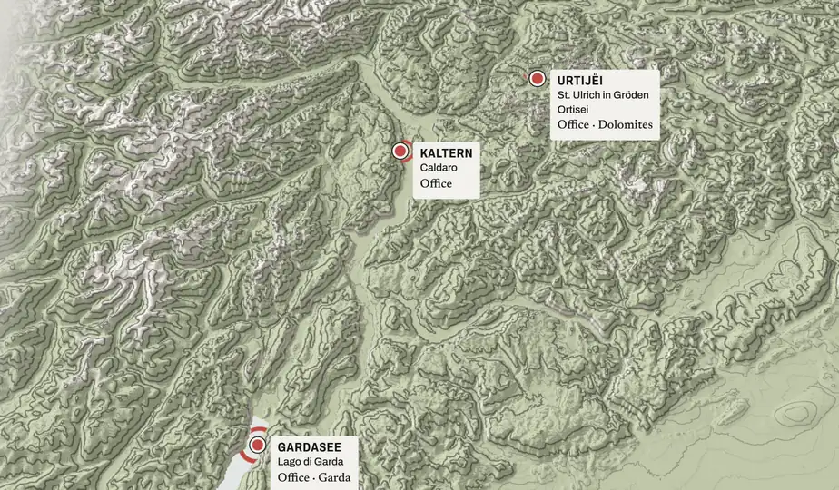 Still: a high view of the whole region, with the three offices marked: Dolomites, Kaltern / Caldaro, Garda.